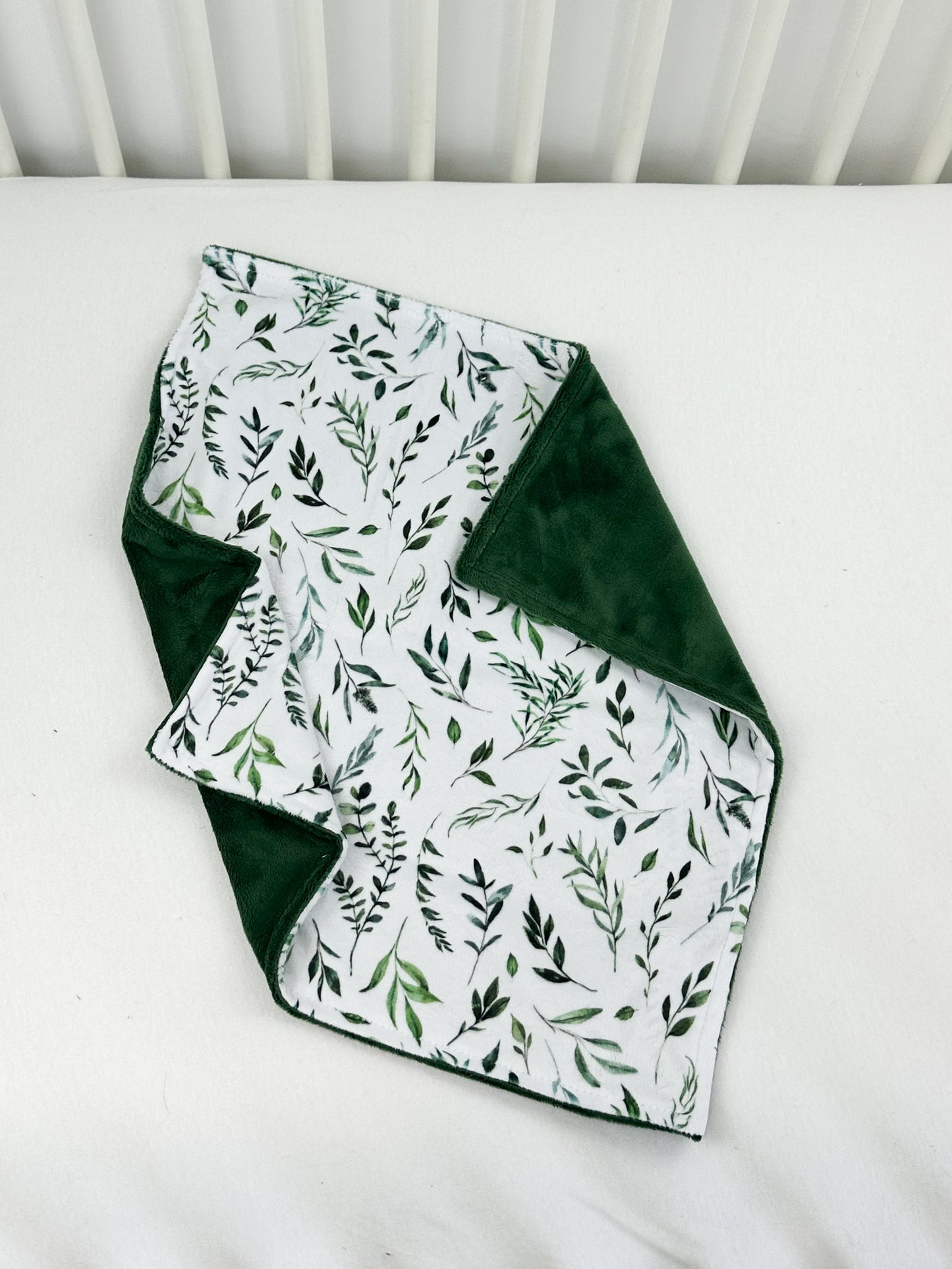 a close up of a quilt on a bed