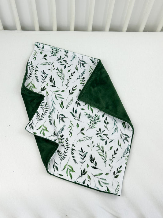 a close up of a quilt on a bed